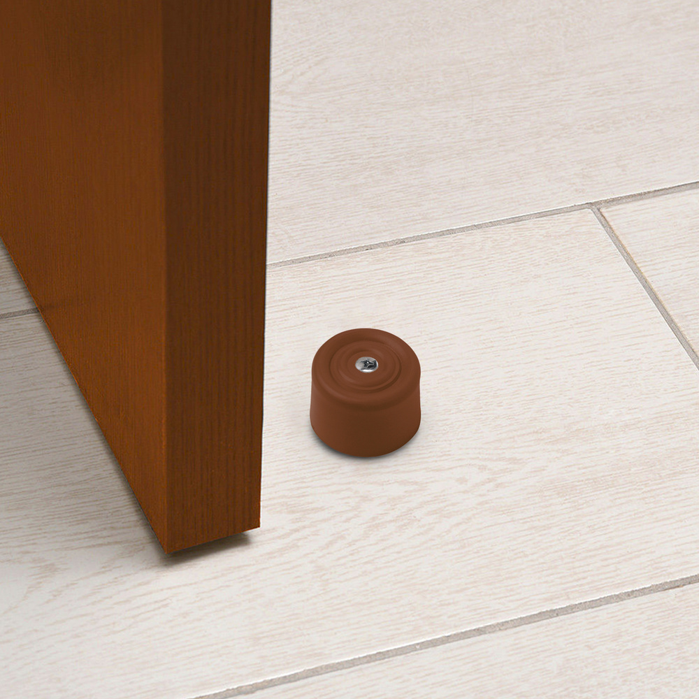 Tope puerta con taco nylon marron (blister 2 piezas). - Color: marron. - Con taco de nylon. - Blister 2 piezas.